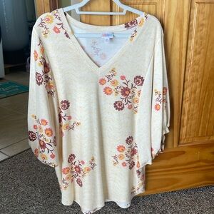 Woman’s Luloroe blouse.
